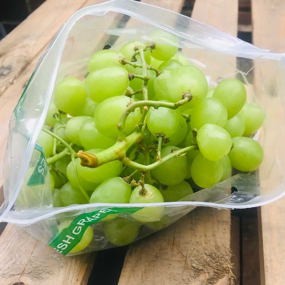 A bag of white grapes